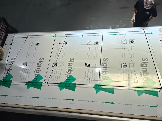 CNC routing signbond sheet — wide bed view