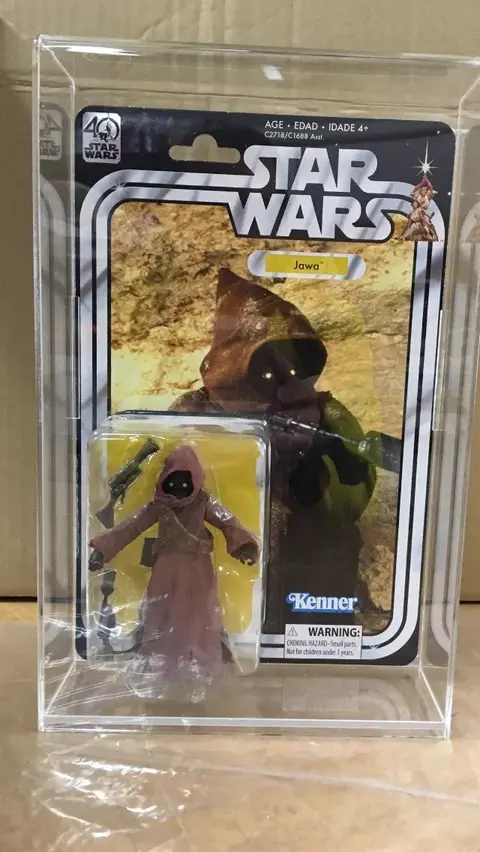 Acrylic display cover protecting collectible figurine