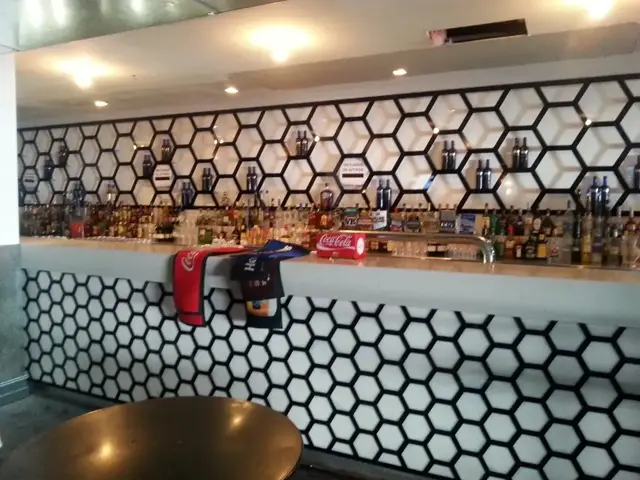 Custom honeycomb acrylic feature wall — Envy Bar