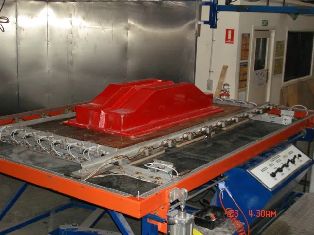 Vacuum forming machine with mould in production