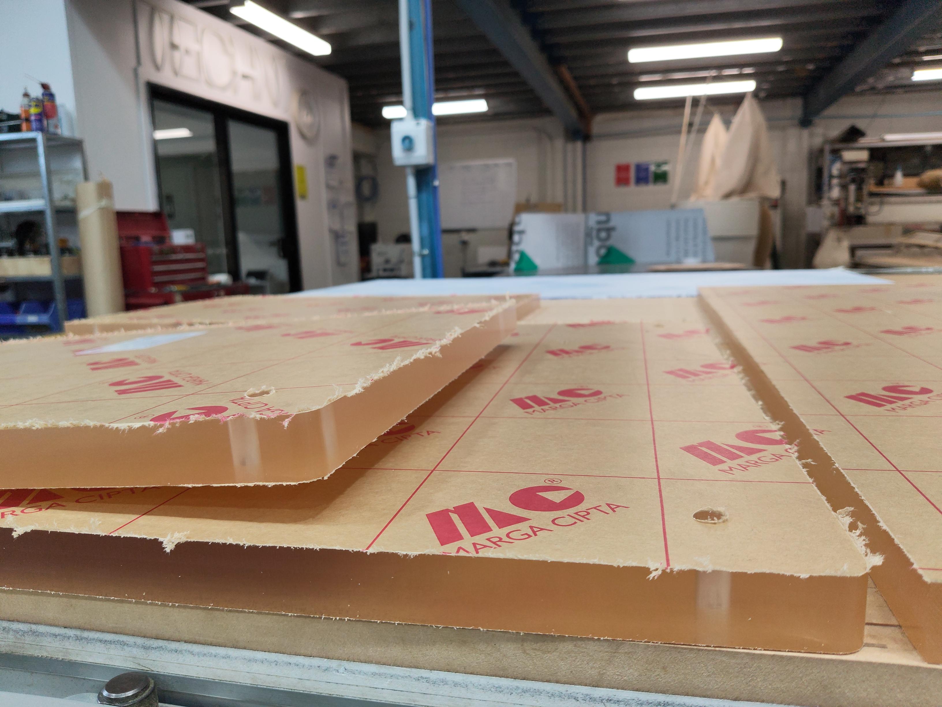 Close-up detail of CNC-routed acrylic sheet edge