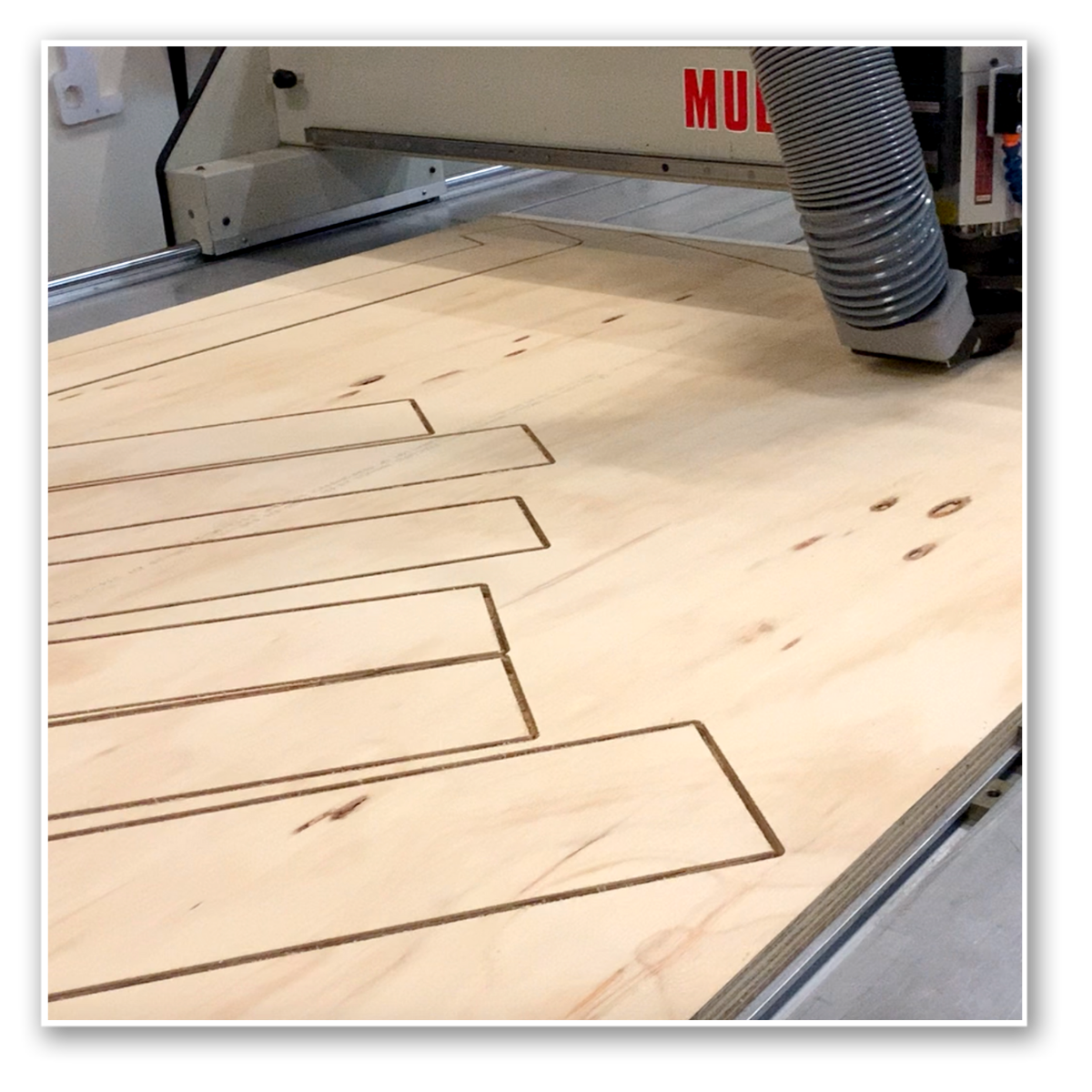 CNC router cutting plywood and plastic materials