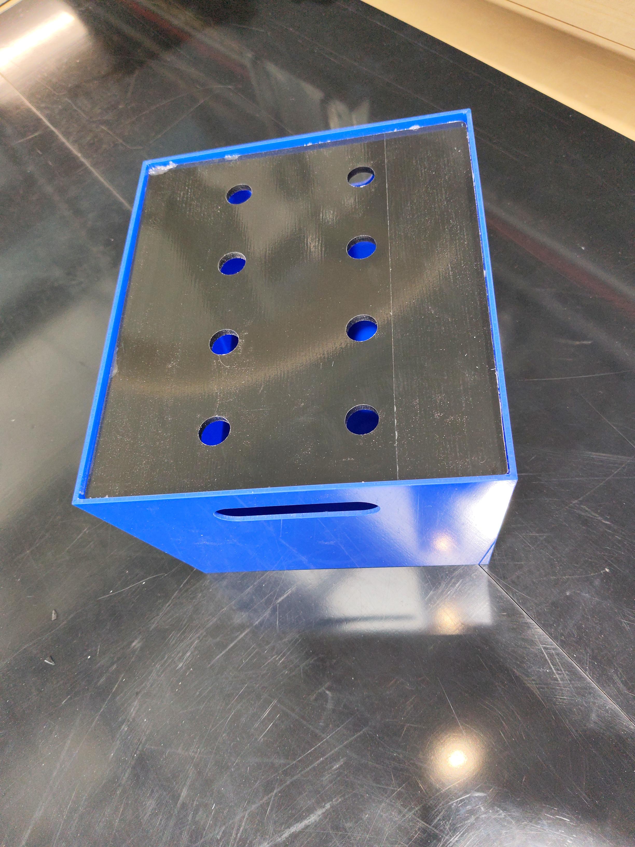 Blue acrylic battery box front view showing clean fabrication joints