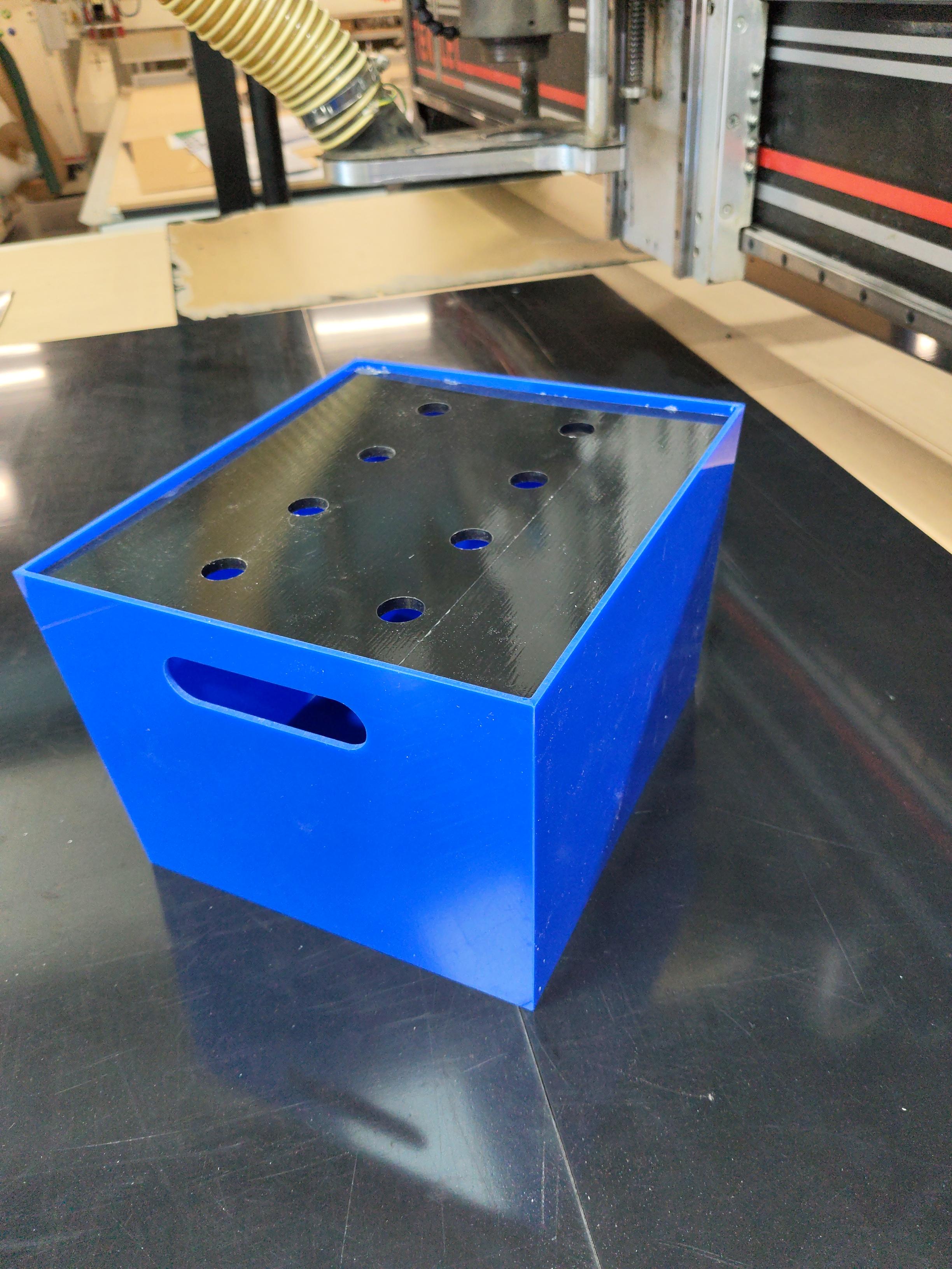 Blue acrylic battery box with hinged lid open showing interior compartment